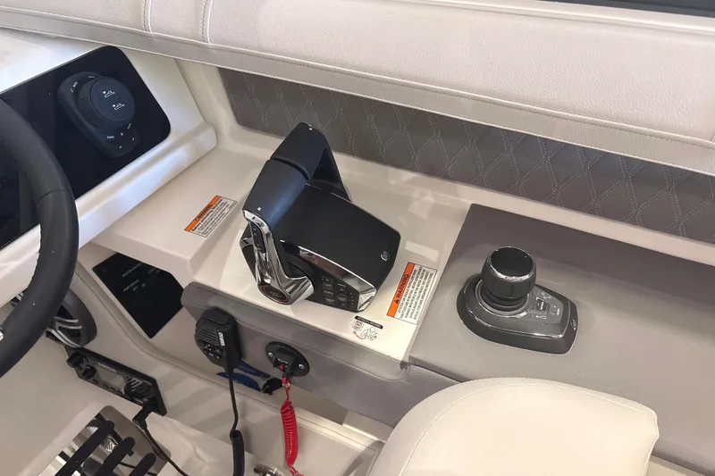 Slide: The Image of 2026 Sea Ray SLX 310 Outboard helm with modern controls and joystick steering. - 28