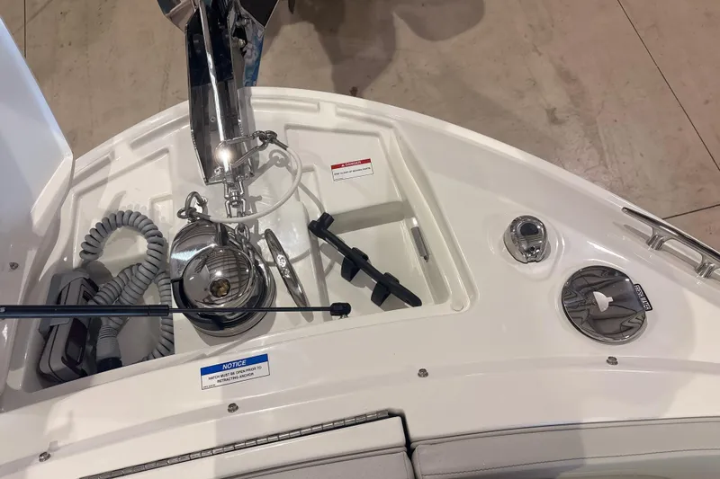 Slide: The Image of 2026 Sea Ray SLX 310 Outboard boat deck with anchor and control panel. - 8