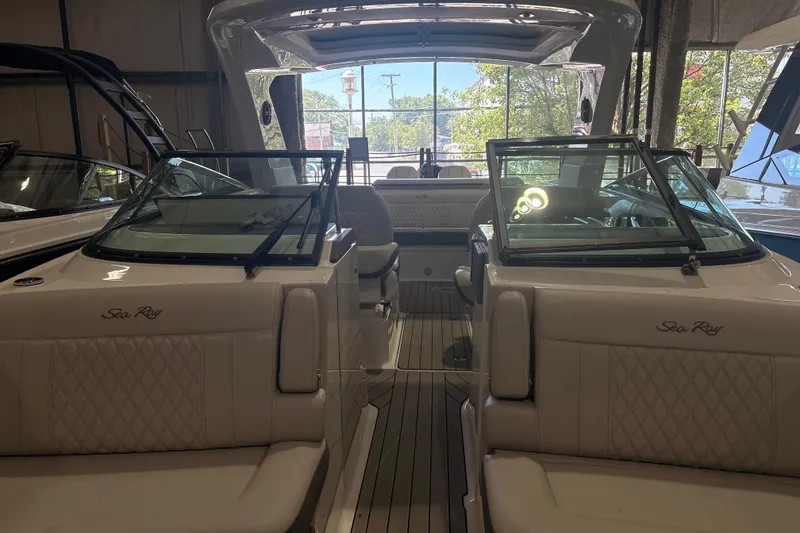 Slide: The Image of 2026 Sea Ray SLX 310 Outboard boat interior with luxurious seating and sleek design. - 9