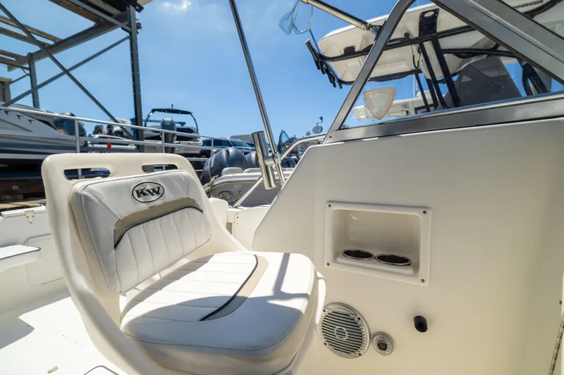 Slide: The Image of Interior of a 2012 KEYWEST 2020 WA boat with white seating and control panel. - 10