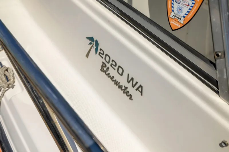 Slide: The Image of Close-up of 2012 KEYWEST 2020 WA boat model with Bluewater logo. - 12