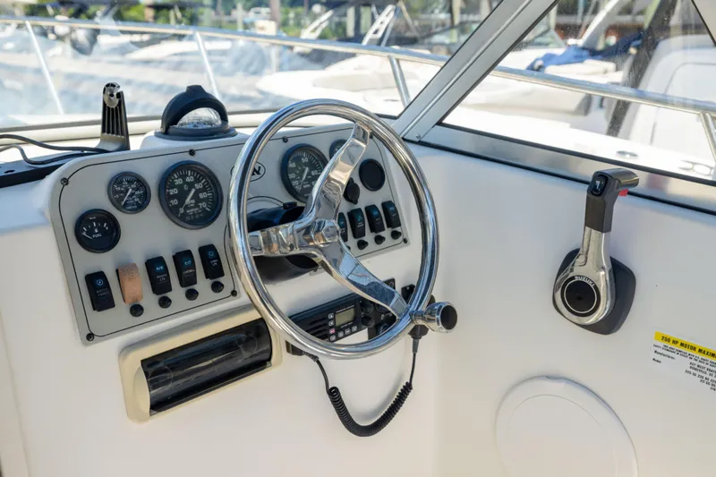 Slide: The Image of Steering console of a 2012 KEYWEST 2020 WA boat with gauges and controls. - 6