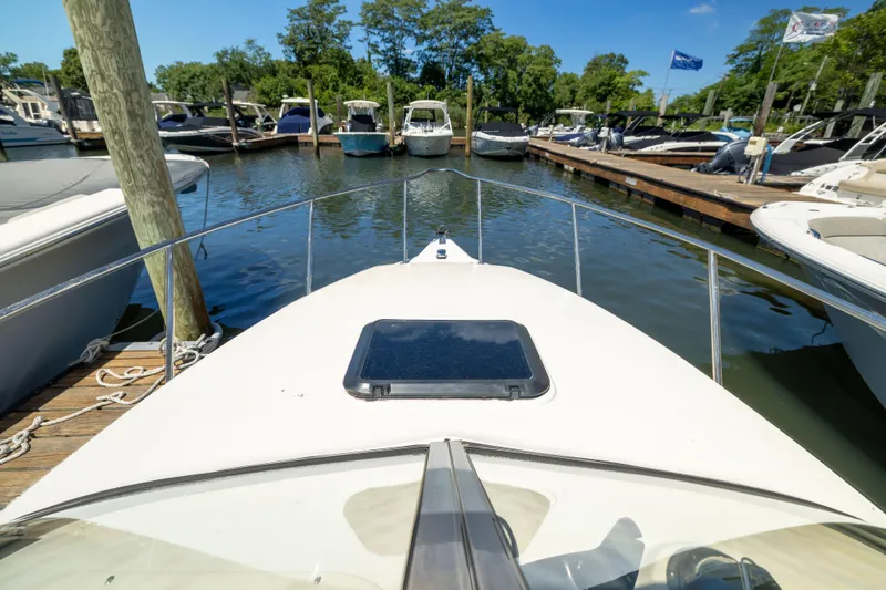 Slide: The Image of Bow view of a 2012 KEYWEST 2020 WA boat docked at a marina. - 9