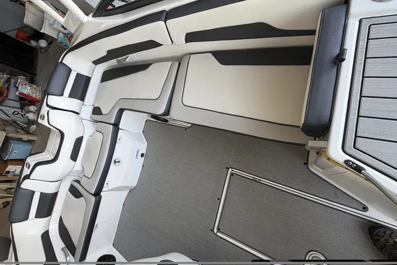 Slide: The Image of 2022 Yamaha Boats AR195 interior with sleek seating and modern design. - 7