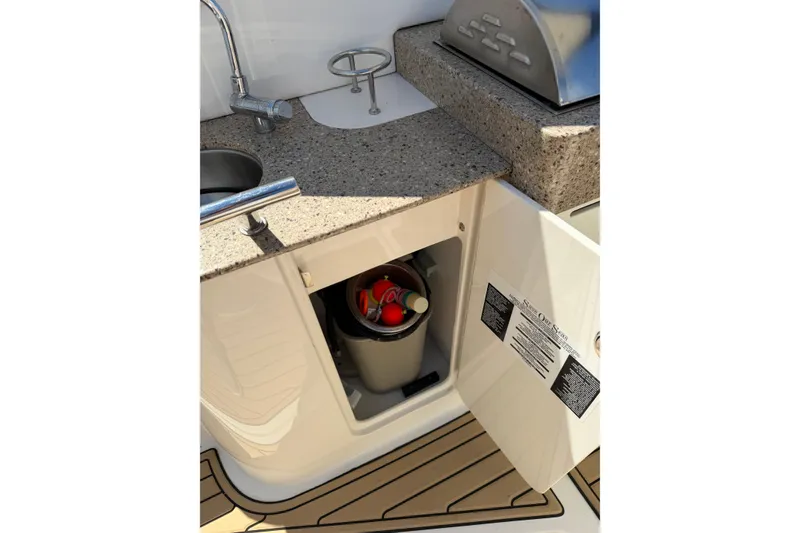Slide: The Image of Outdoor kitchenette on 2016 Sea Ray Sundancer 330 yacht with sink and storage. - 16