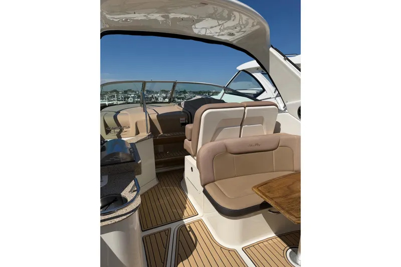 Slide: The Image of Interior of 2016 Sea Ray Sundancer 330 yacht with elegant seating and wooden flooring. - 12