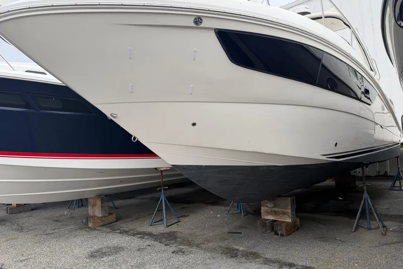 Slide: The Image of 2016 Sea Ray Sundancer 330 yacht on stands, side view in storage. - 35
