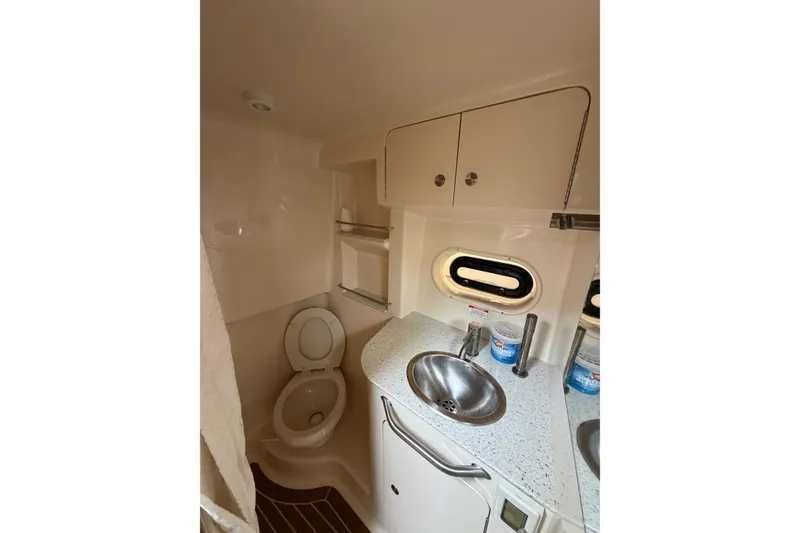 Slide: The Image of Bathroom interior of 2016 Sea Ray Sundancer 330 yacht with sink and toilet. - 26