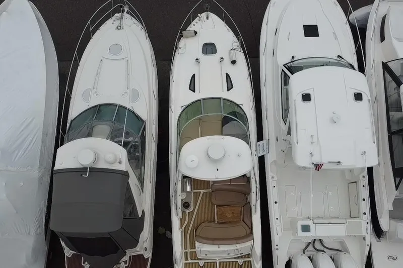 Slide: The Image of Aerial view of a 2016 Sea Ray Sundancer 330 yacht docked among other boats. - 6