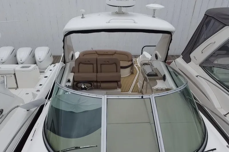 Slide: The Image of 2016 Sea Ray Sundancer 330 boat with spacious cockpit and luxurious seating. - 5