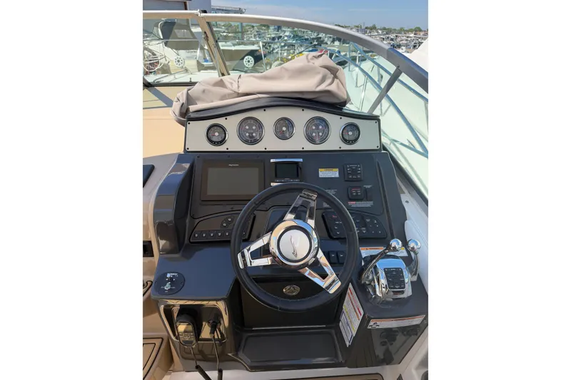 Slide: The Image of Helm of 2016 Sea Ray Sundancer 330 with steering wheel and control panel. - 8