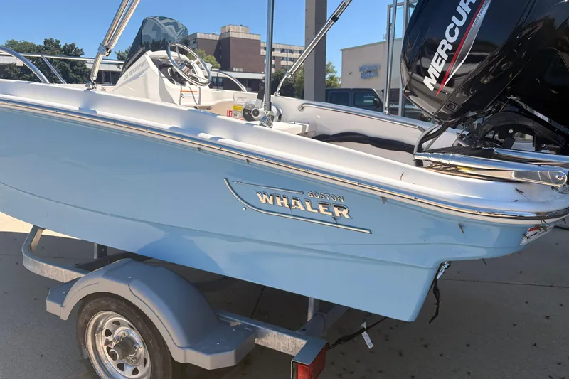 Slide: The Image of 2026 Boston Whaler Super Sport 13 boat with Mercury engine on trailer. - 2