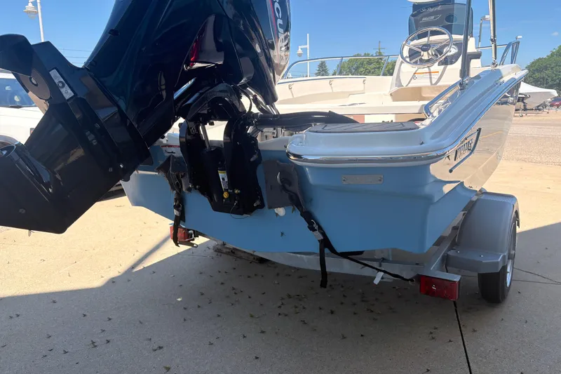 Slide: The Image of 2026 Boston Whaler Super Sport 13 boat on trailer, rear view with outboard motor. - 3