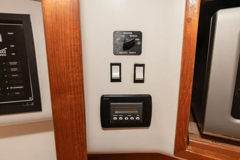 Slide: The Image of Control panel with heater settings and electronic display. - 11