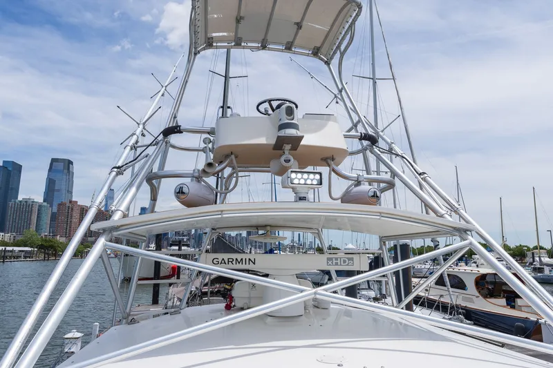 Slide: The Image of A 2011 Carolina Classic 32 boat with an elevated helm and Garmin equipment. - 28