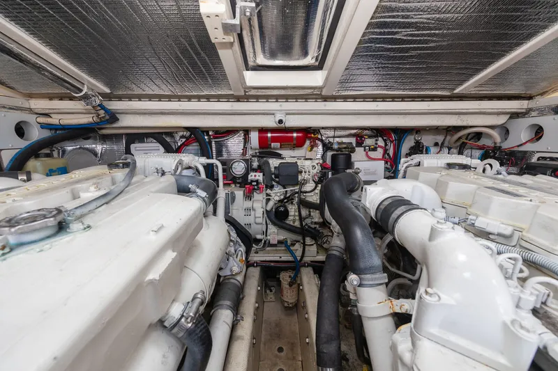Slide: The Image of Engine room of a boat with two large engines and various hoses and cables. - 33
