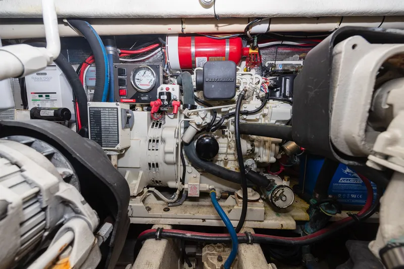Slide: The Image of Engine room of a boat with various machinery and cables. - 34