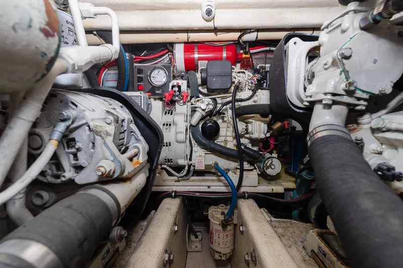 Slide: The Image of Boat engine room with various machinery and hoses. - 35