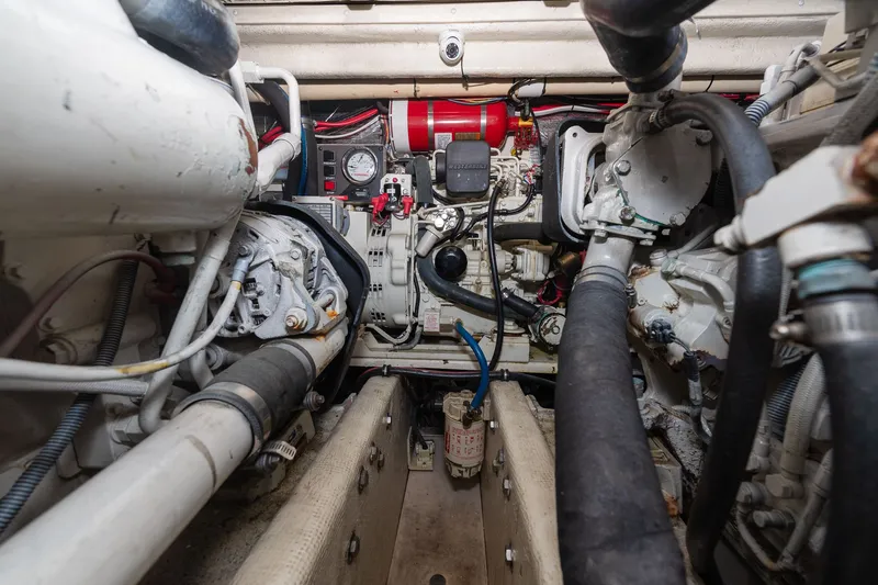 Slide: The Image of Engine room of a boat with various machinery and cables. - 36