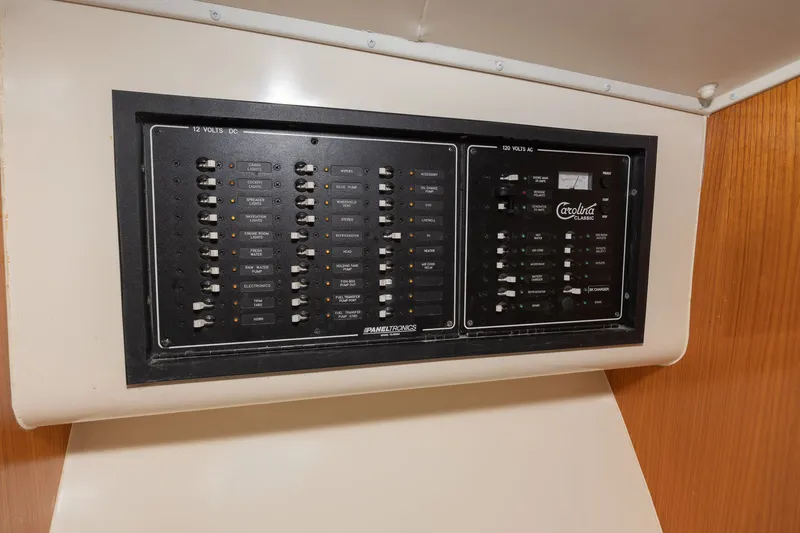 Slide: The Image of Electrical control panel on a boat with various switches and indicators. - 8