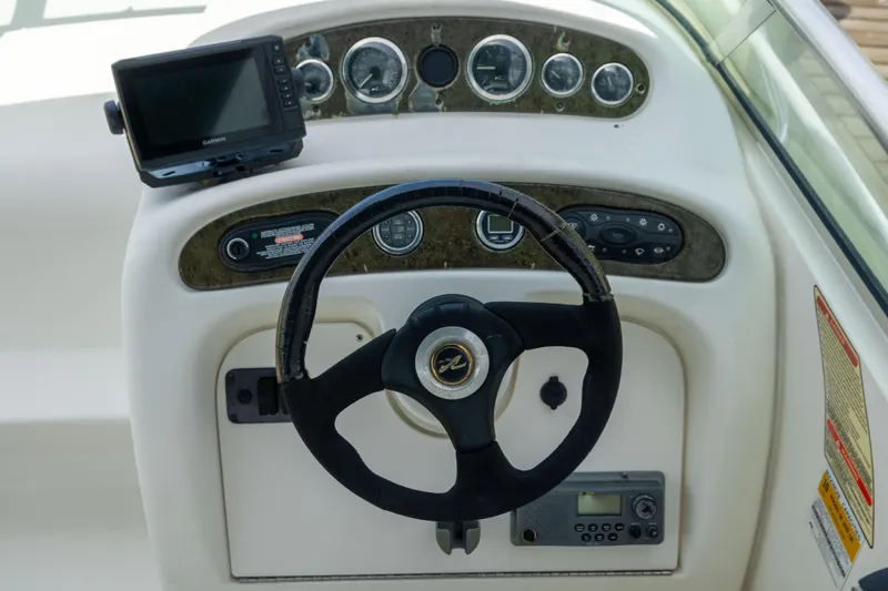 Slide: The Image of Steering console of 2002 Searay 260 Sundancer with Garmin GPS and instrument panel. - 20