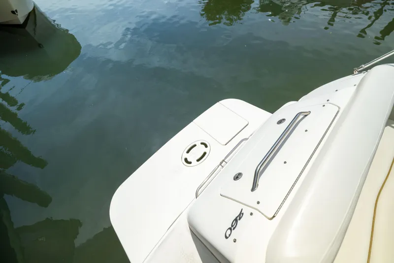 Slide: The Image of 2002 Searay 260 Sundancer boat deck with water reflection. - 27