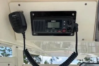 Slide: The Image of 2014 Scout 240 Bay Scout boat radio and microphone setup. - 13
