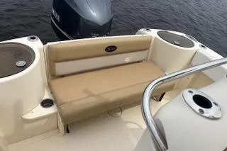 Slide: The Image of 2014 Scout 240 Bay Scout boat with beige seating and Yamaha outboard motor. - 14