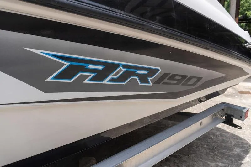 Slide: The Image of 2017 Yamaha Boats AR190 side view with logo on trailer. - 23