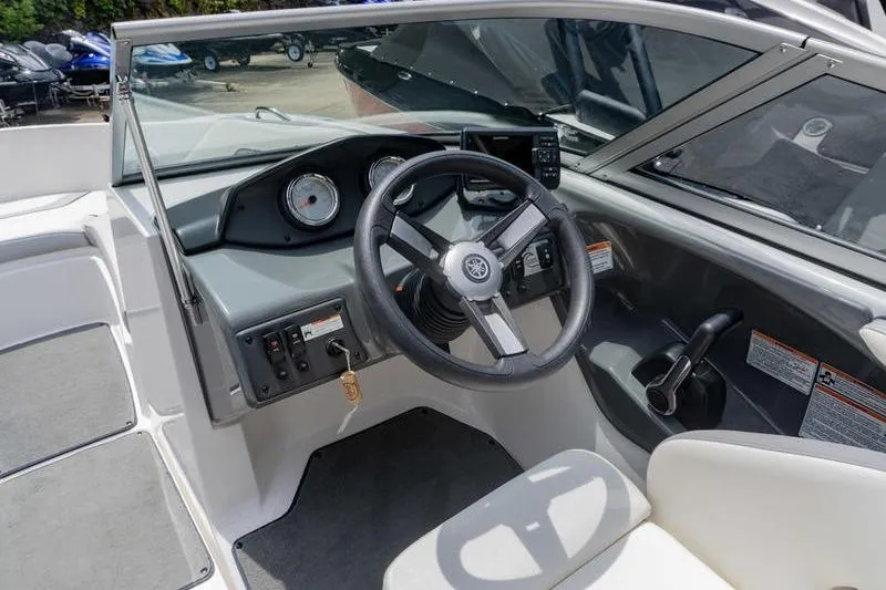 Slide: The Image of 2017 Yamaha Boats AR190 cockpit with steering wheel and dashboard controls. - 31