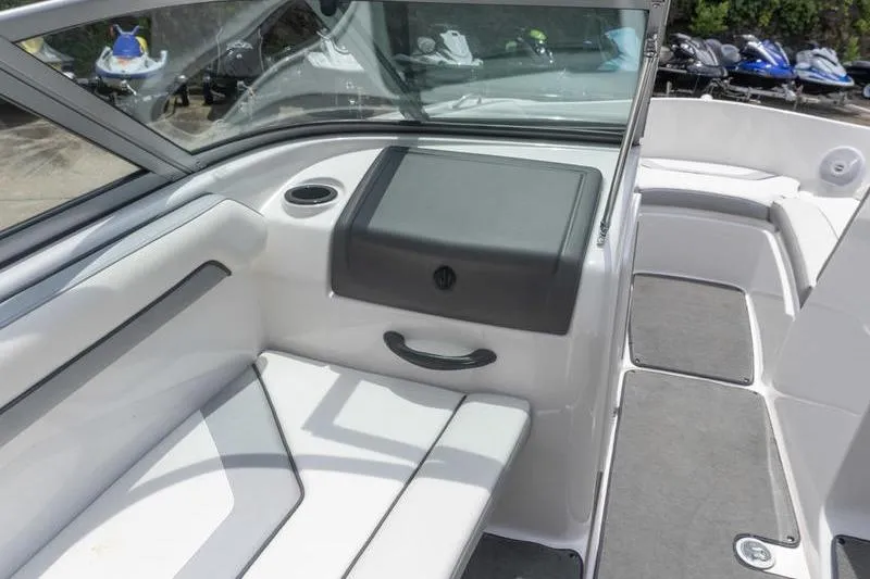 Slide: The Image of 2017 Yamaha Boats AR190 interior with seating and storage compartment. - 33