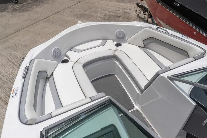 Slide: The Image of 2017 Yamaha Boats AR190 interior with white cushioned seating and speakers. - 36