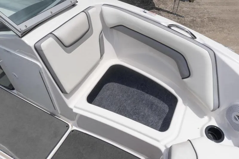 Slide: The Image of 2017 Yamaha Boats AR190 interior seating area with cushioned seats and carpeted flooring. - 37