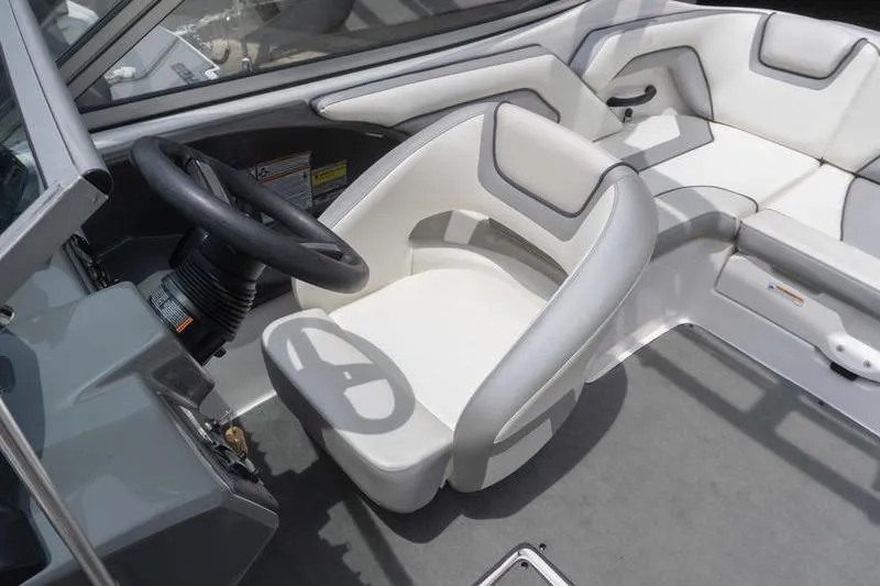 Slide: The Image of Interior of a 2017 Yamaha Boats AR190, featuring sleek seating and steering wheel. - 41