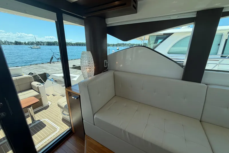 Slide: The Image of Interior view of 2016 Tiara Yachts C39 Coupe with waterfront backdrop. - 16