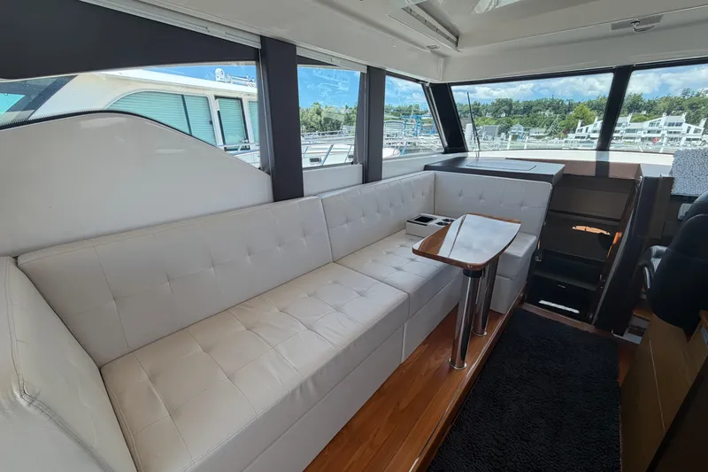 Slide: The Image of Luxurious interior of 2016 Tiara Yachts C39 Coupe with plush seating and elegant table. - 17