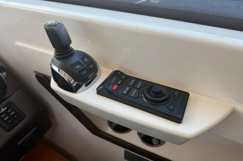 Slide: The Image of Control panel of a 2016 Tiara Yachts C39 Coupe, featuring joystick and navigation controls. - 18