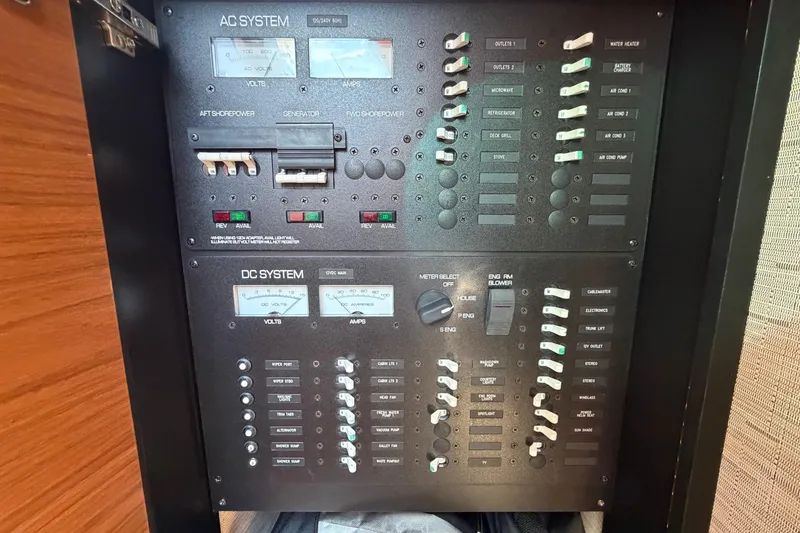 Slide: The Image of Electrical control panel on a 2016 Tiara Yachts C39 Coupe, featuring AC and DC systems. - 27