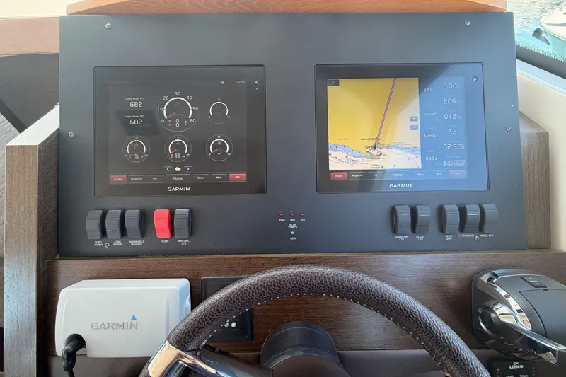 Slide: The Image of Dashboard of 2016 Tiara Yachts C39 Coupe with Garmin navigation displays. - 29