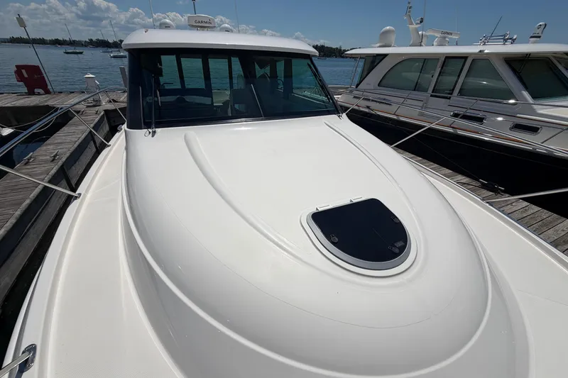 Slide: The Image of 2016 Tiara Yachts C39 Coupe docked, showcasing sleek design and spacious deck. - 31