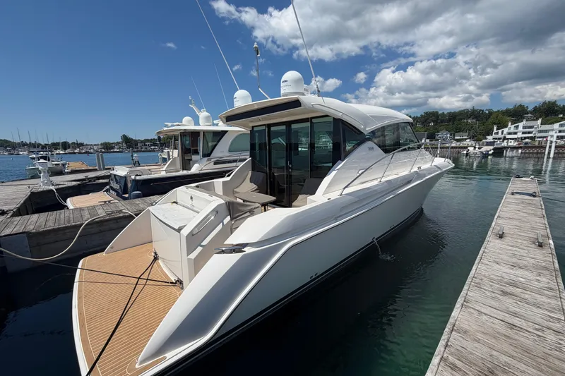 Slide: The Image of 2016 Tiara Yachts C39 Coupe docked at marina under clear blue sky. - 33