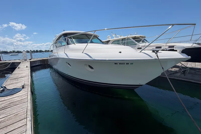 Slide: The Image of 2016 Tiara Yachts C39 Coupe docked at marina under clear blue sky. - 34