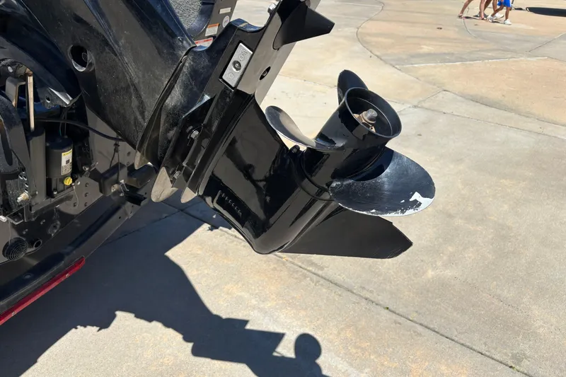 Slide: The Image of Close-up of a 2021 Alumacraft Classic 165 boat motor propeller on concrete surface. - 11
