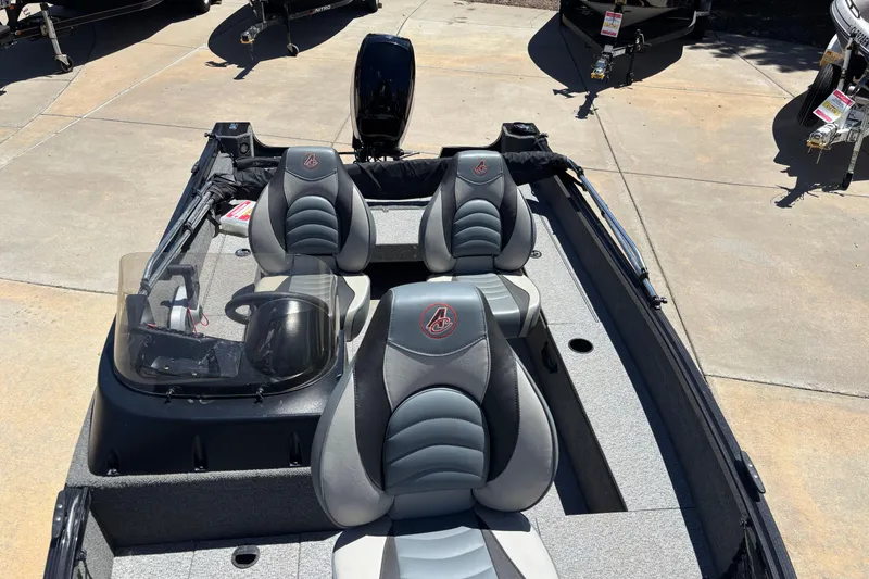 Slide: The Image of 2021 Alumacraft Classic 165 boat interior with dual seats and steering console. - 4