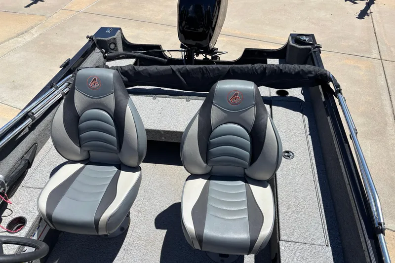 Slide: The Image of 2021 Alumacraft Classic 165 boat interior with two gray seats and motor. - 5