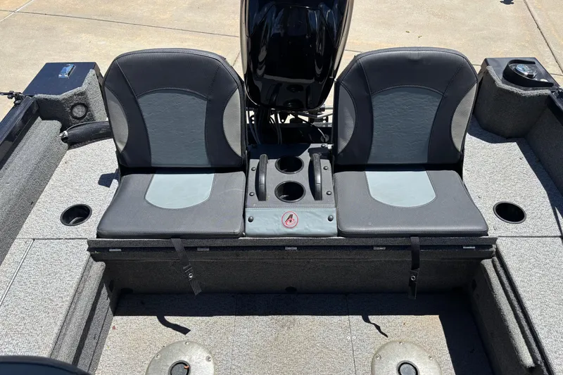 Slide: The Image of 2021 Alumacraft Classic 165 boat seats with cup holders and storage compartments. - 7
