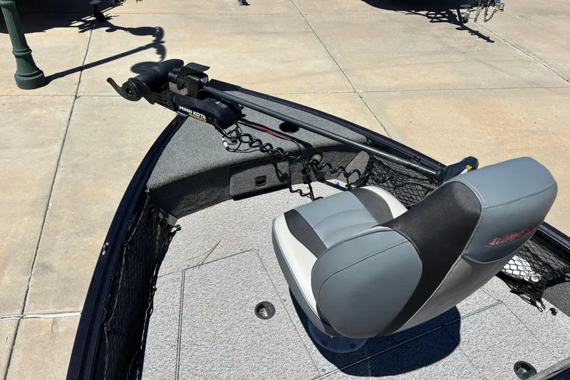 Slide: The Image of 2021 Alumacraft Classic 165 boat with Minn Kota trolling motor and cushioned seat. - 8