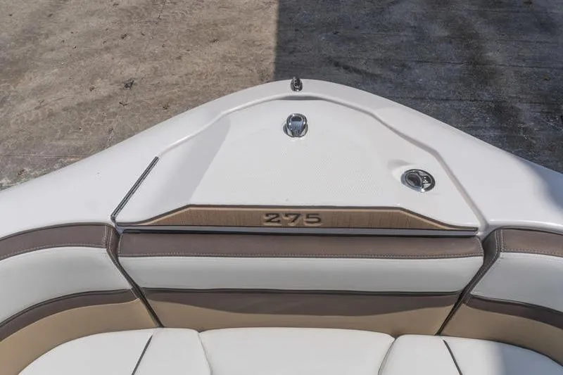 Slide: The Image of 2023 Yamaha Boats 275SDX bow seating area with sleek design and modern upholstery. - 20