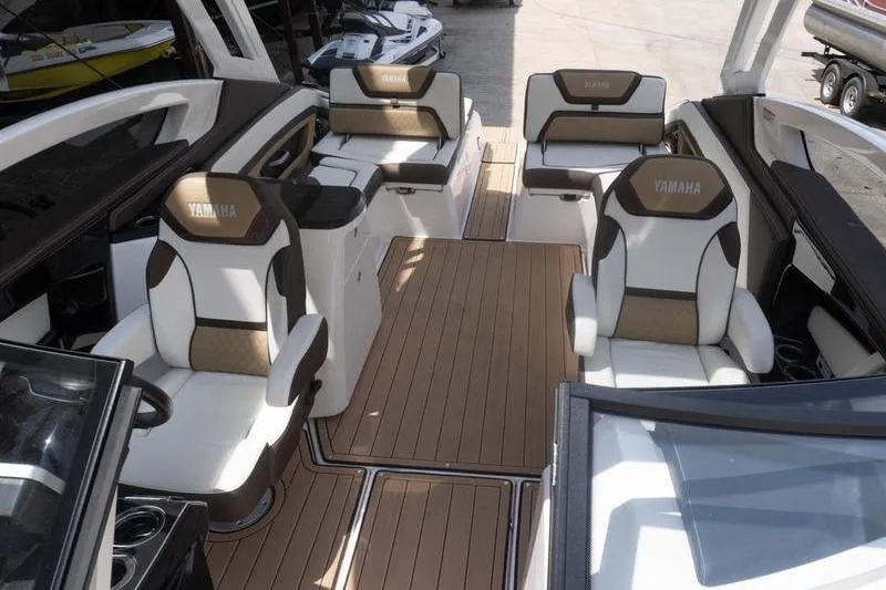 Slide: The Image of 2023 Yamaha Boats 275SDX interior with luxurious seating and sleek design. - 22