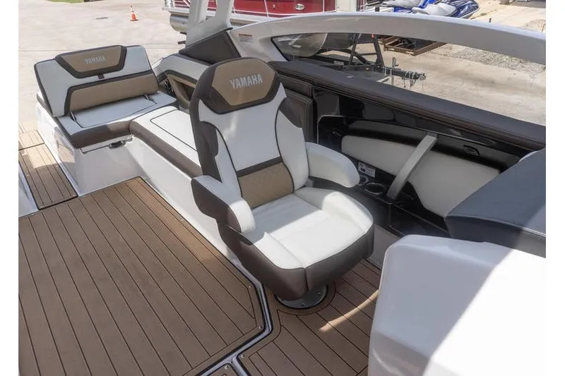 Slide: The Image of 2023 Yamaha Boats 275SDX interior with luxurious seating and sleek design. - 24